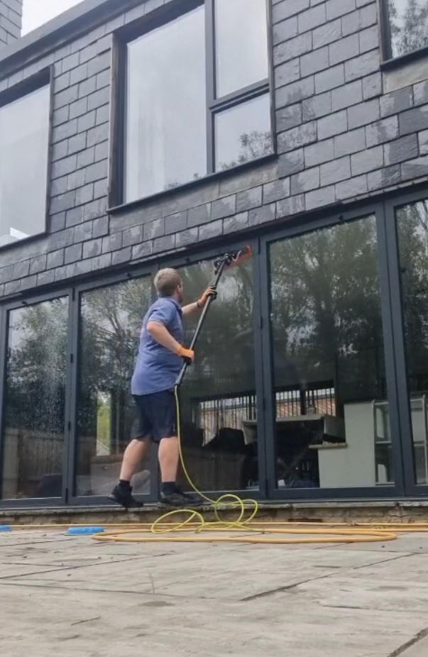 Tytherington 2 An image of a window cleaner using a water-fed pole for a large house in Tytherington